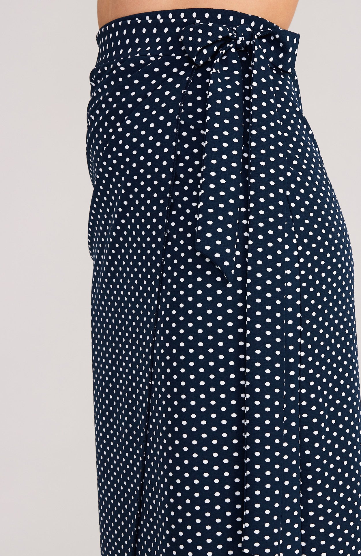 draped wrap skirt in polka dots